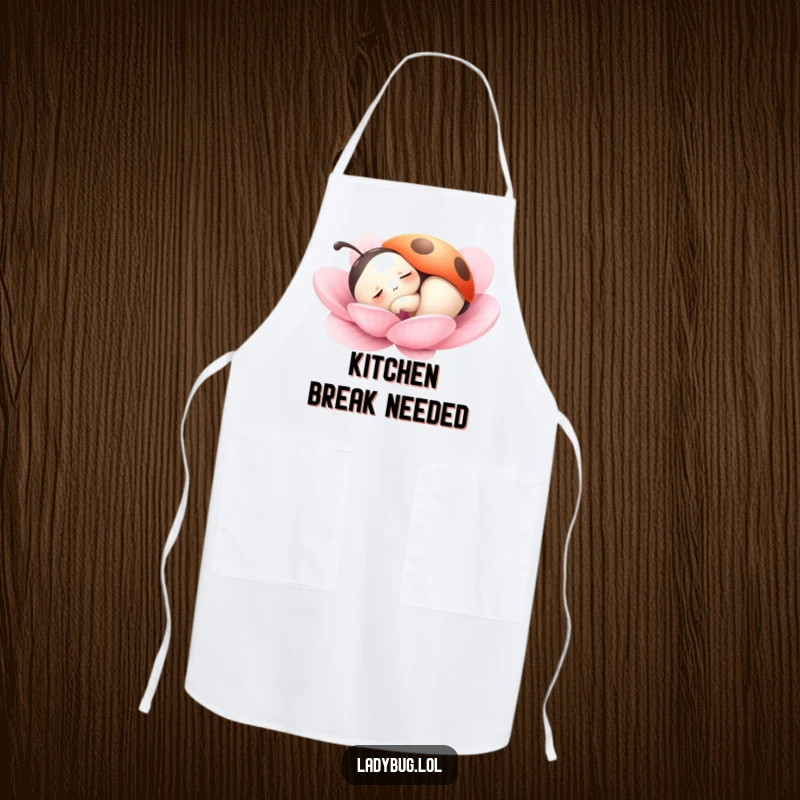 Funny apron showcasing a ladybug character peacefully dozing on a petal, adding humor and a sense of calm to kitchen tasks.