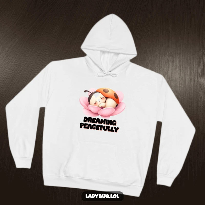 Funny hoodie featuring a ladybug character peacefully dozing on a petal, offering cozy comfort and a serene, sleepy vibe.