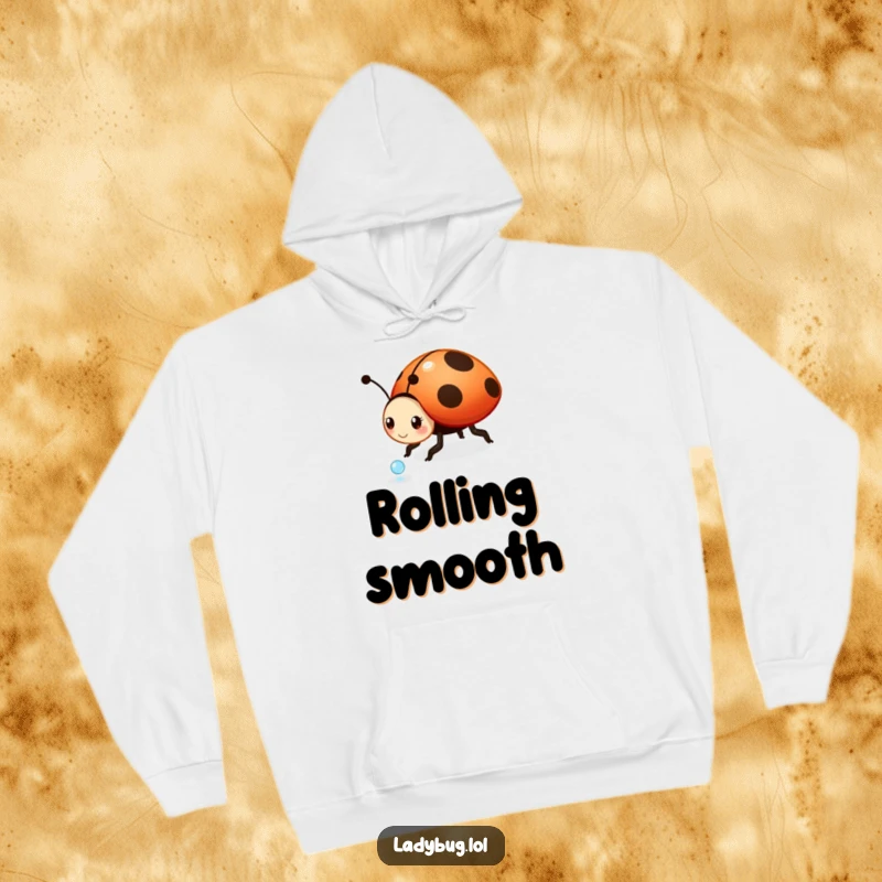 Funny ladybug hoodie: a playful ladybug character in motion, rolling a sparkling dewdrop, symbolizing lightheartedness and carefree joy.