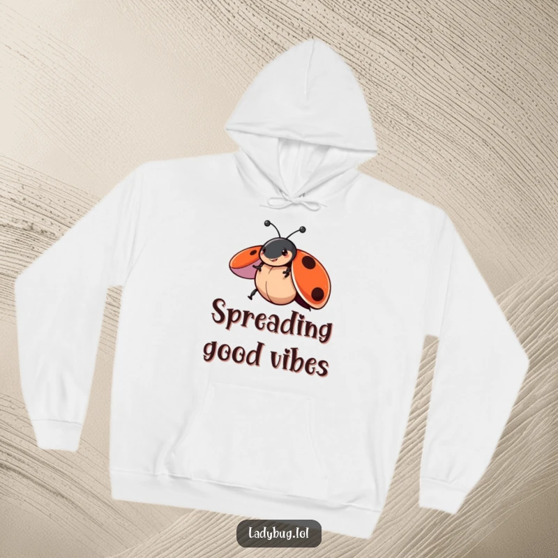 Funny hoodie featuring a ladybug character in a playful spin with wings open, offering cozy comfort and a cheerful, whimsical vibe.