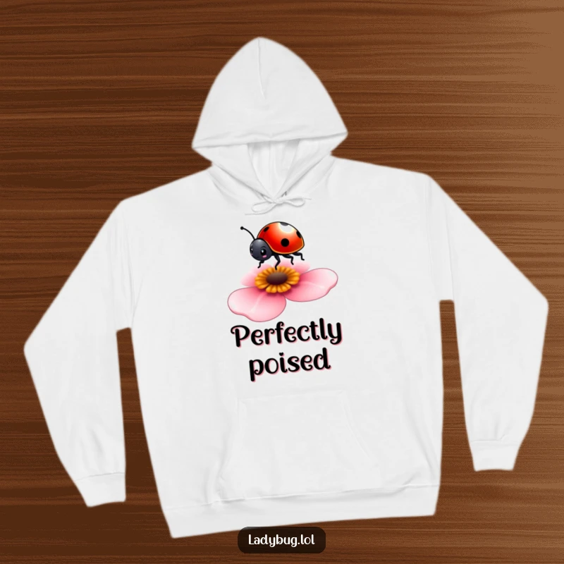 Funny hoodie depicting a tiny ladybug balancing on a petal, offering warmth and whimsical style.