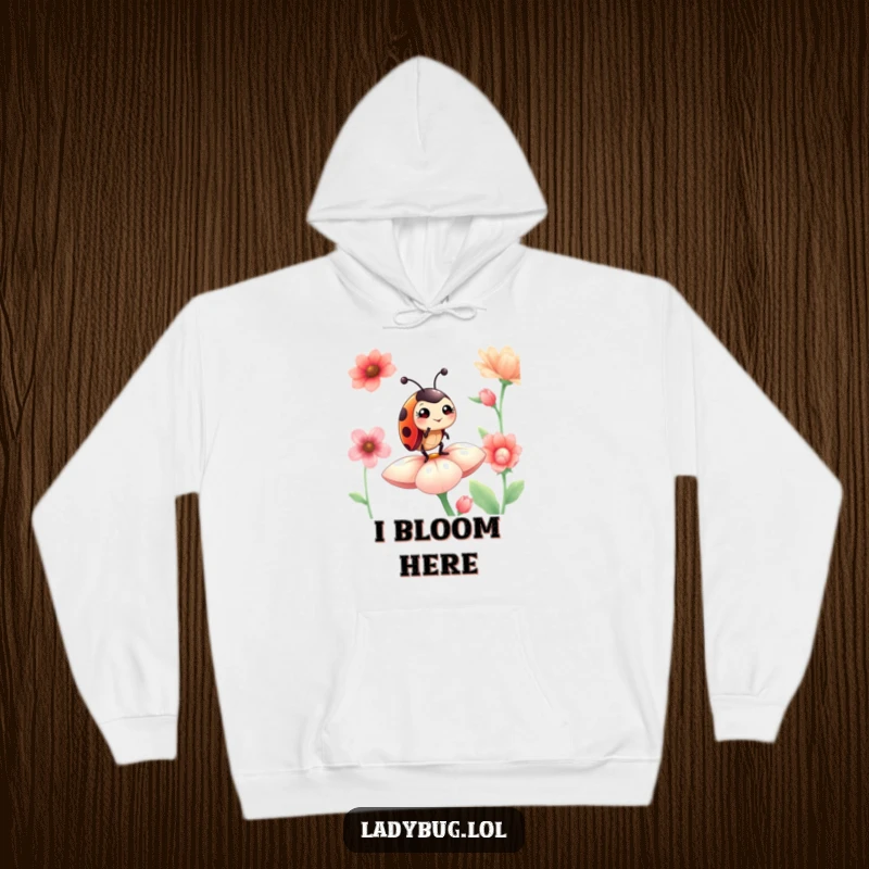 Funny ladybug hoodie featuring a proud ladybug giving a cheeky wink while standing majestically on a colorful flower petal.