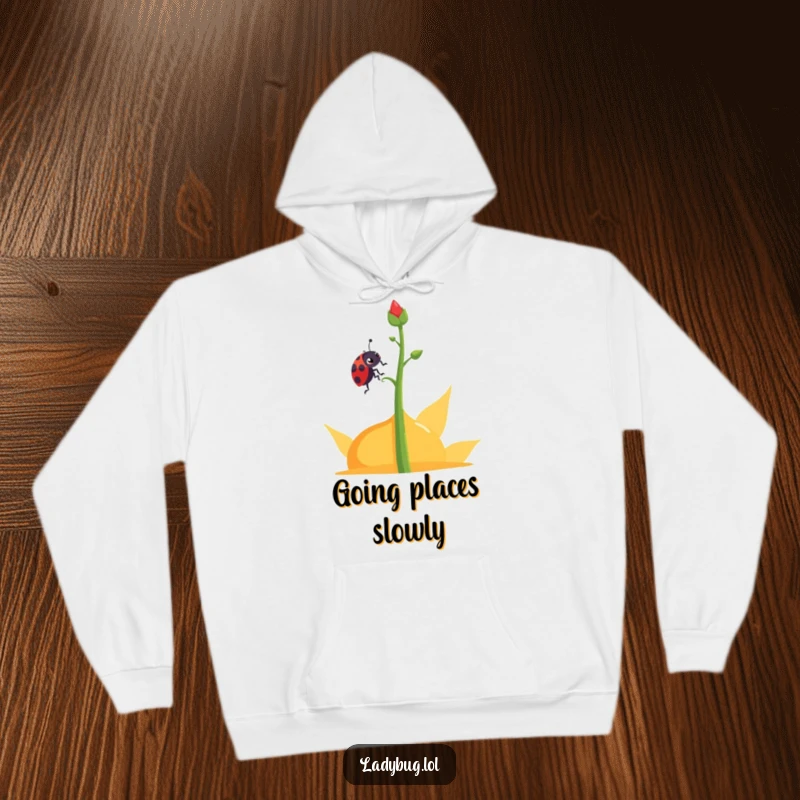Funny determined ladybug hoodie showing a ladybug character climbing an abstract plant stem, offering comfort and inspiration.