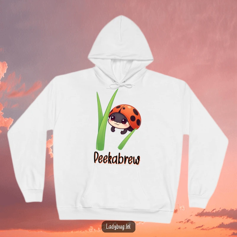 Funny ladybug hoodie featuring a curious ladybug character peeking from behind a green blade of grass, offering cozy charm.