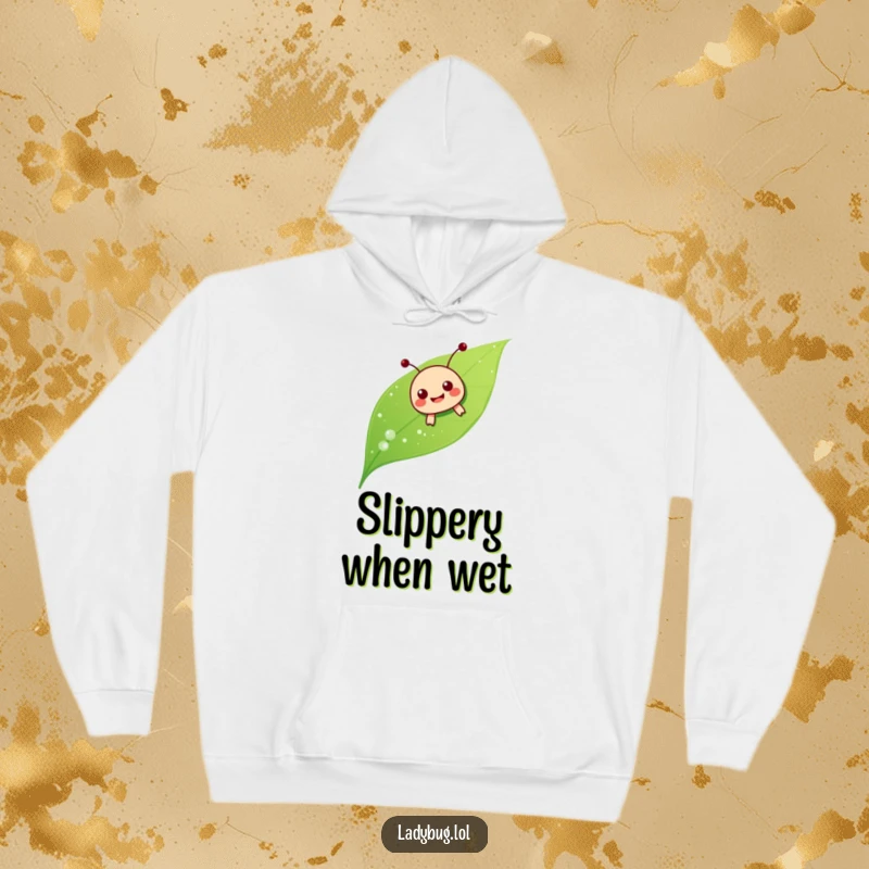 Funny ladybug sliding hoodie, showing the insect joyfully sliding down a dewy leaf, comfort and humor combined.