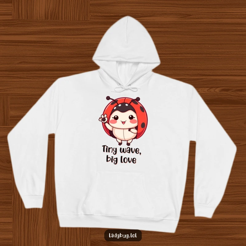 Funny ladybug hoodie depicting a ladybug waving a leg, combining comfort with cute charm, an excellent funny gift for bug lovers.