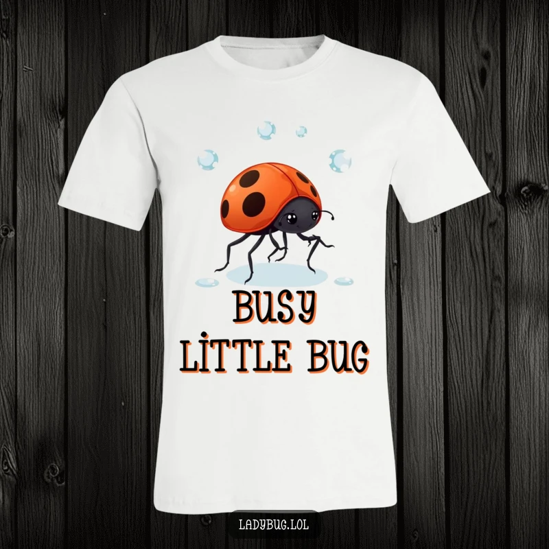 Funny Ladybug Dewdrop T-Shirt: A giggling ladybug comically juggles dewdrops with its tiny legs, displaying impressive and amusing coordination.