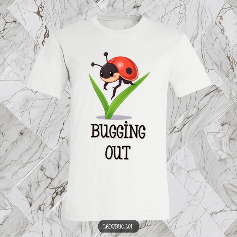 Funny ladybug t-shirt: a tenacious ladybug character determinedly ascending a tall blade of grass, inspiring strength and focus.