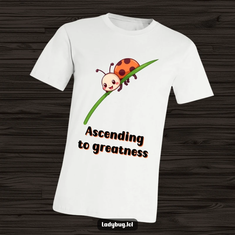 Funny ladybug t-shirt showing a cheerful insect crawling with enthusiasm up a tall blade of grass, full of determination.