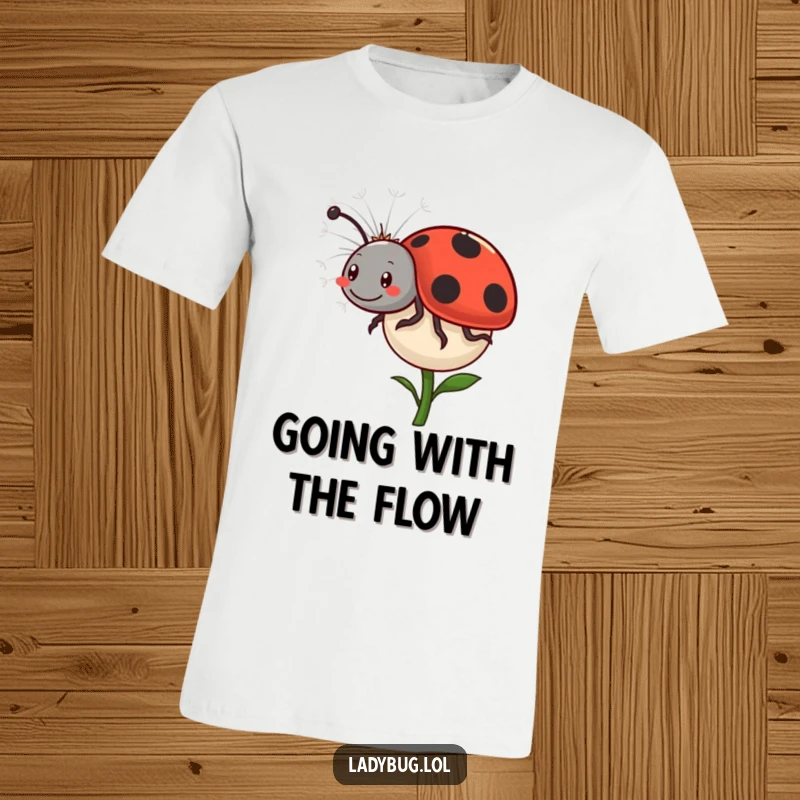 Funny Ladybug Dandelion T-Shirt: A happy ladybug comically rides a floating dandelion seed, showcasing a carefree and adventurous spirit. Fun bug apparel.