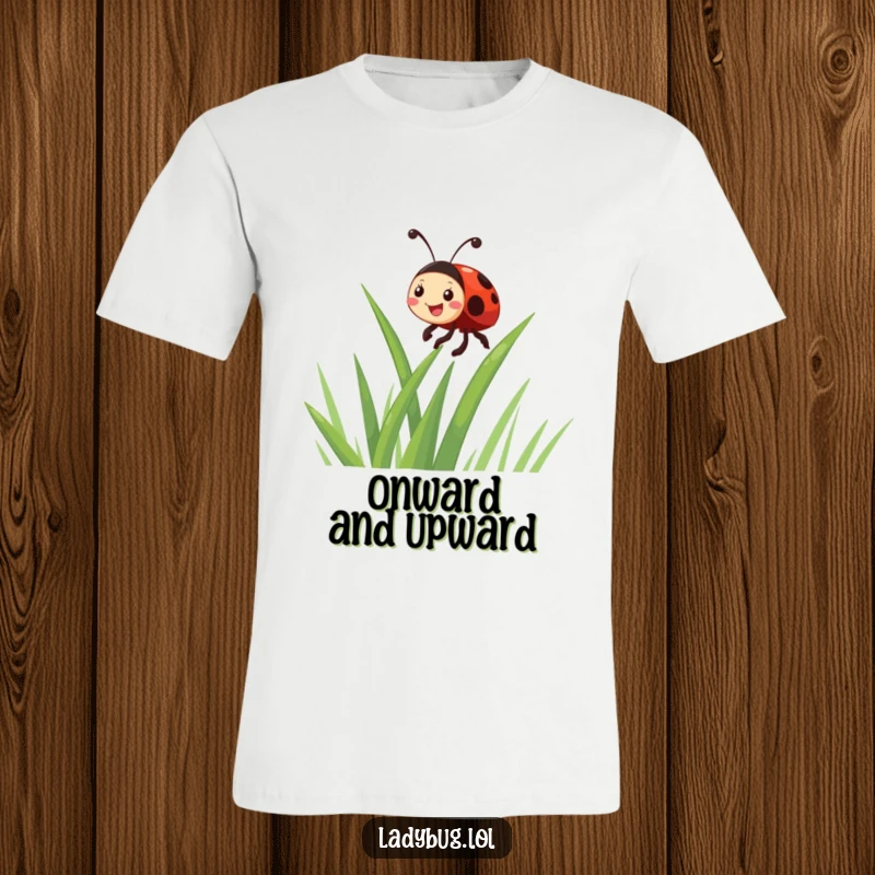 Funny giggling ladybug character enthusiastically climbing a blade of grass, printed on a delightful t-shirt for lovers of humor.