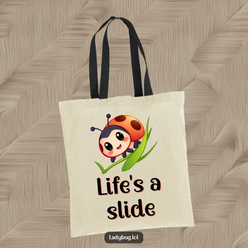 Funny Ladybug Tote Bag: Cute ladybug with big eyes joyfully sliding down a grass blade, representing freedom and playful enjoyment.