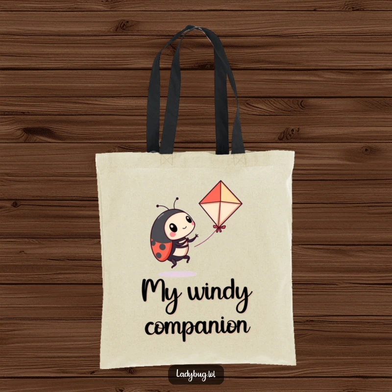 Funny ladybug tote bag depicting a playful ladybug comically attempting to fly a miniature kite, a humorous and functional accessory.