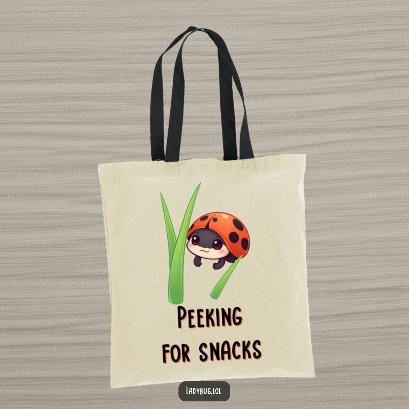Funny ladybug tote bag with a cute ladybug character peeking inquisitively from behind a blade of grass, ready for adventures.